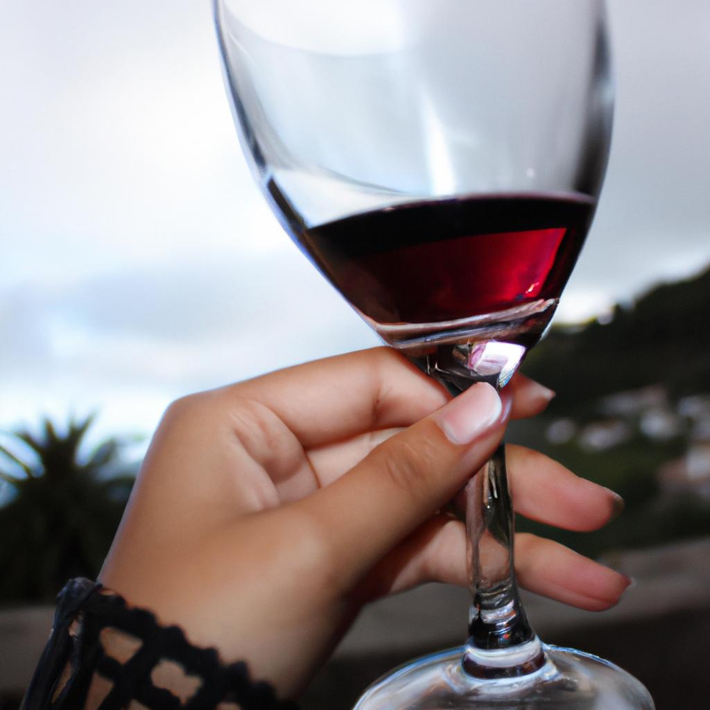 Person holding a wine glass